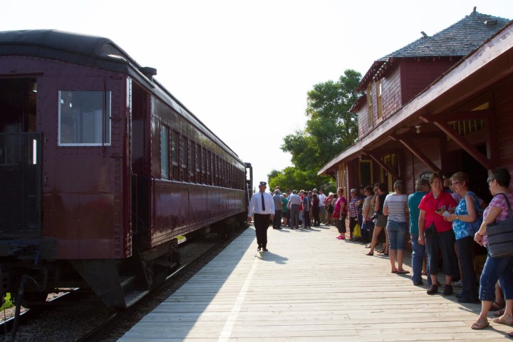 a group of people sitting at a train station